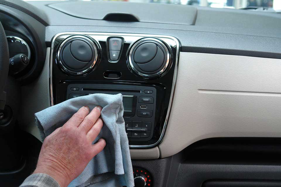Cleaning car with a cloth