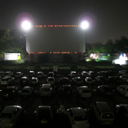 A nighttime scene of a drive-in theater