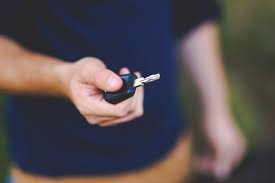 a person holding car keys