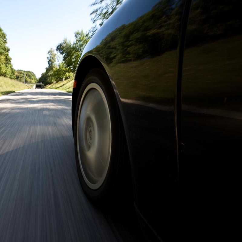 car driving down road
