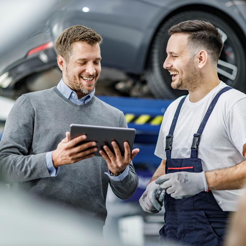man talking to mechanic