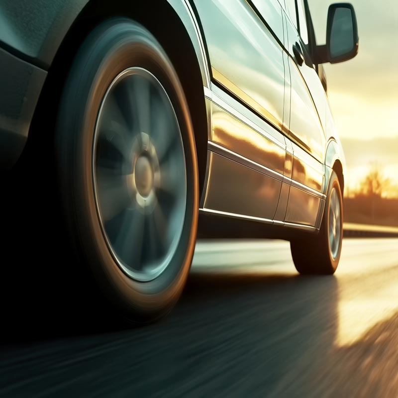 car driving down road